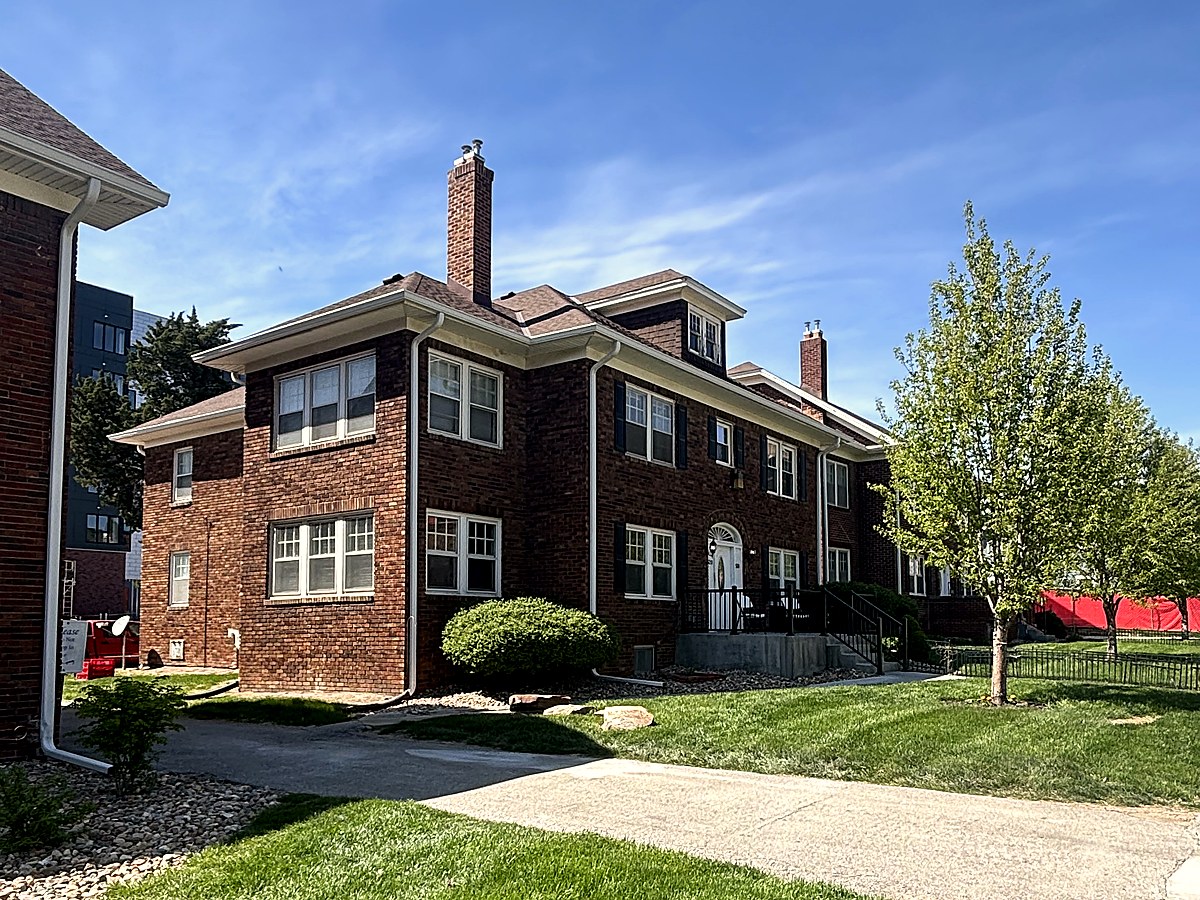 OSL brick home exterior with green lawn