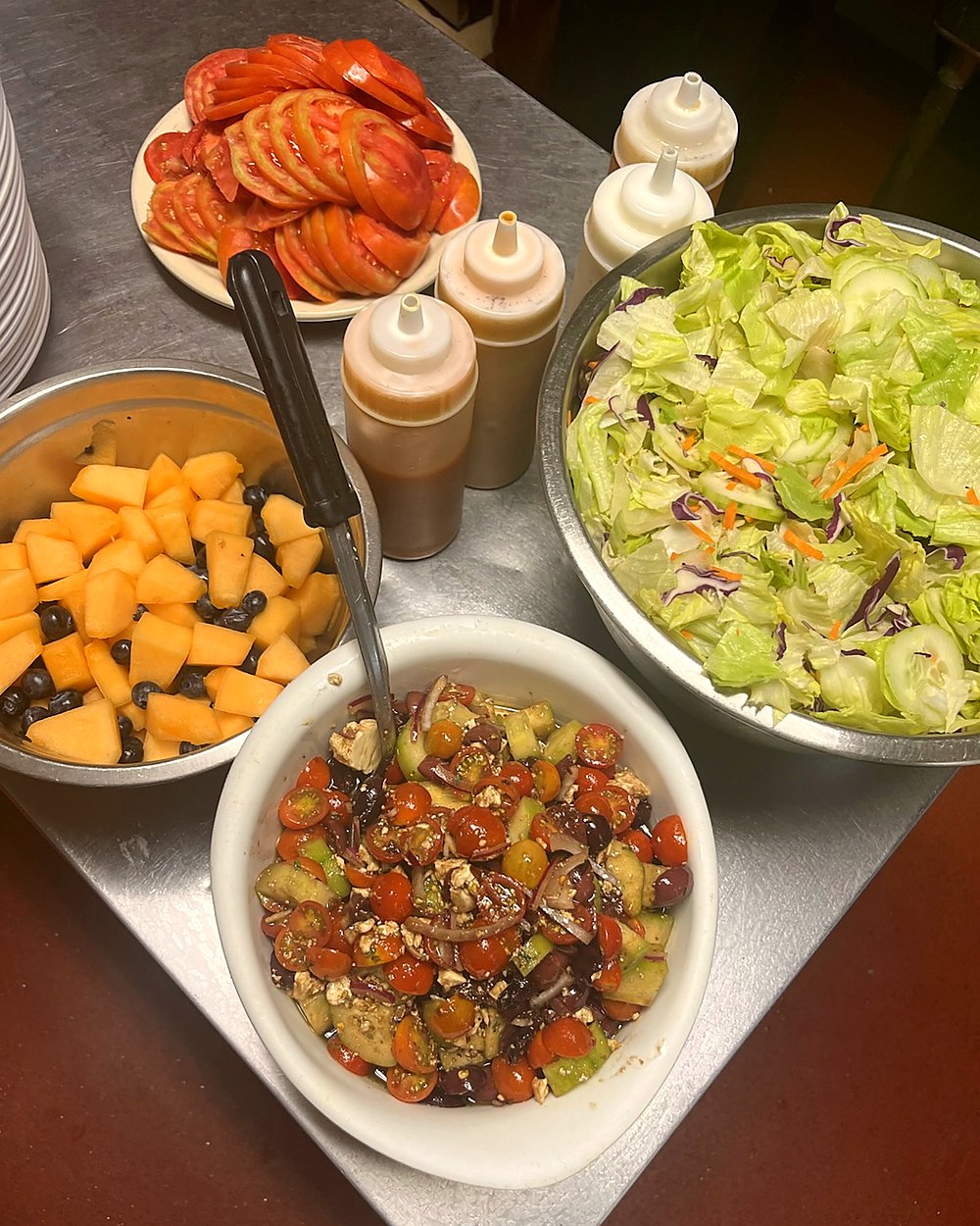 Chef John&rsquo;s fresh food spread - tomatoes, salad, fruit