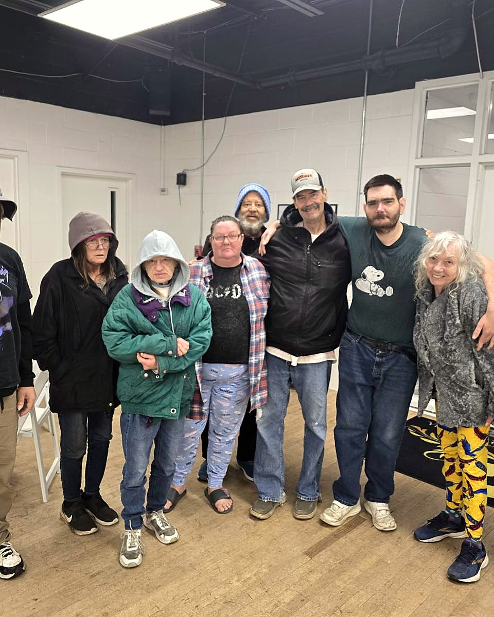 OSL residents and friends standing together at a community event