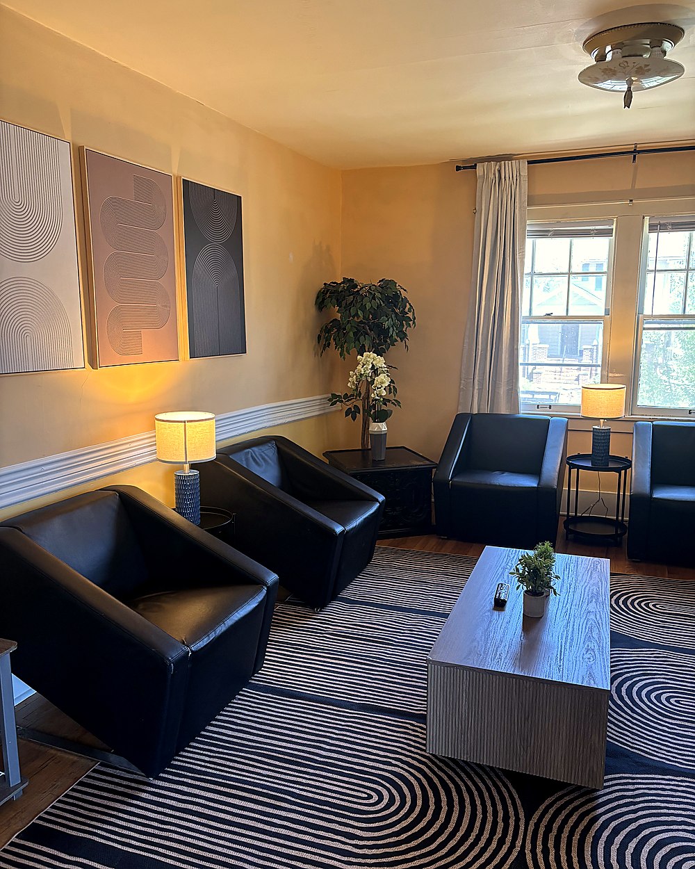 Designer living room with leather chair and modern art
