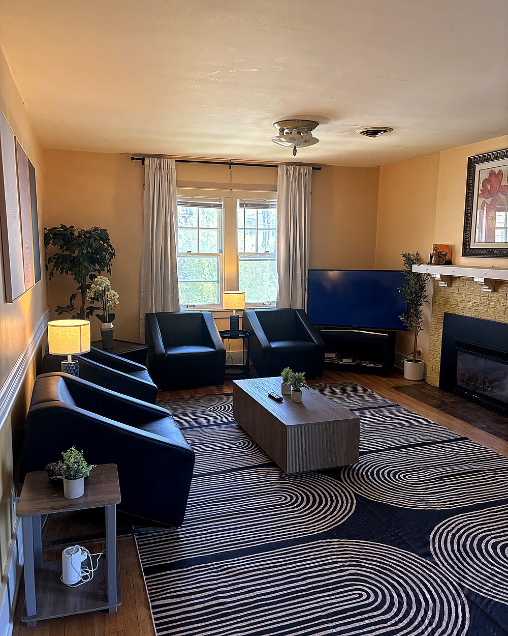 Living room with blue chair and warm lamp light